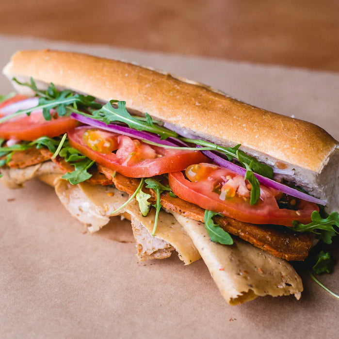 Vegan deli meat slices on a sandwich